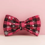 Red plaid bowtie with star and snowflake motifs on matching fabric knot