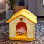 Yellow plush pet house bed with front doorway, soft roof, and warm interior cushion