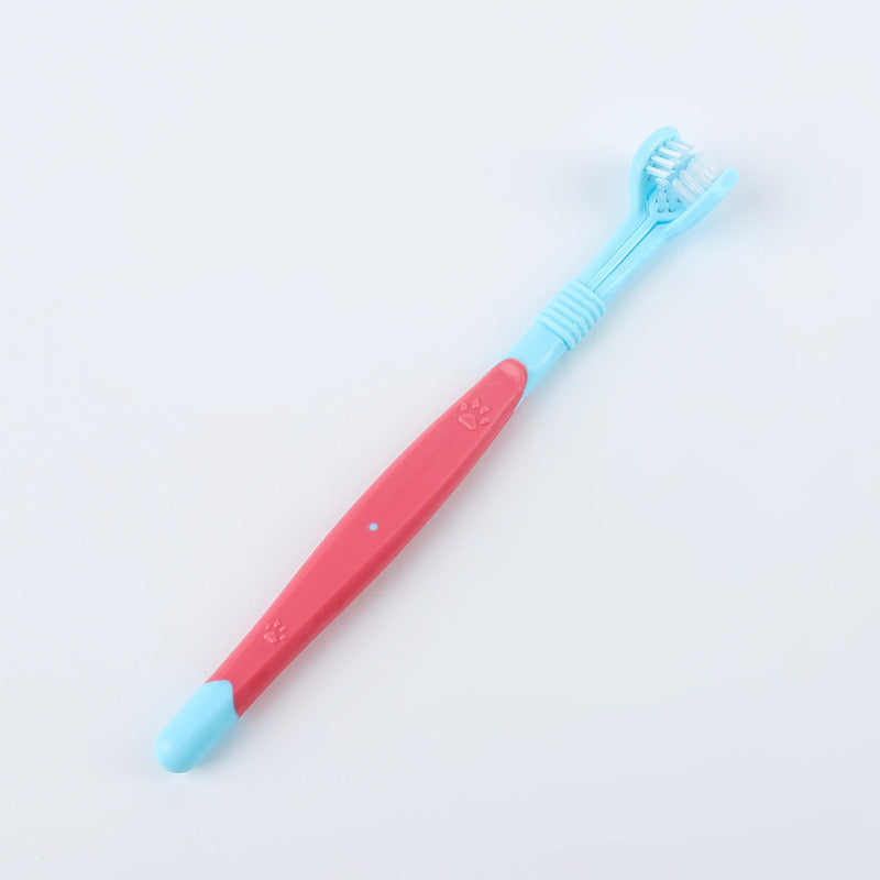 Pet toothbrush with red handle and light blue soft bristles