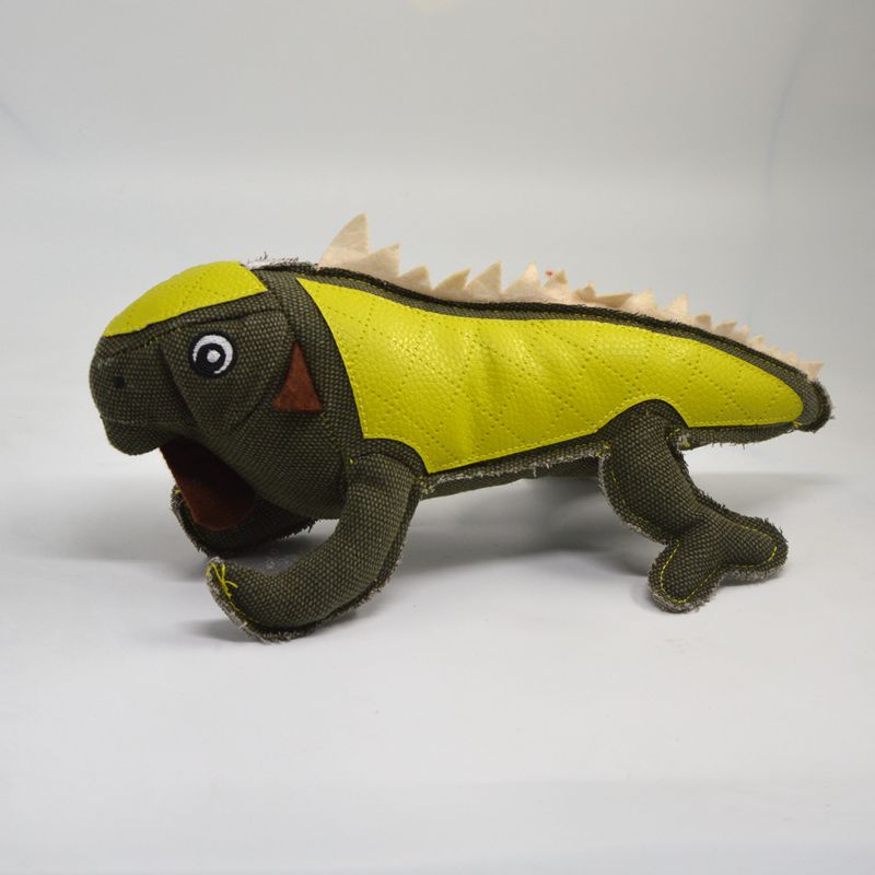 Yellow-and-green long-bodied stuffed animal plush toy with stitched face and spiky back