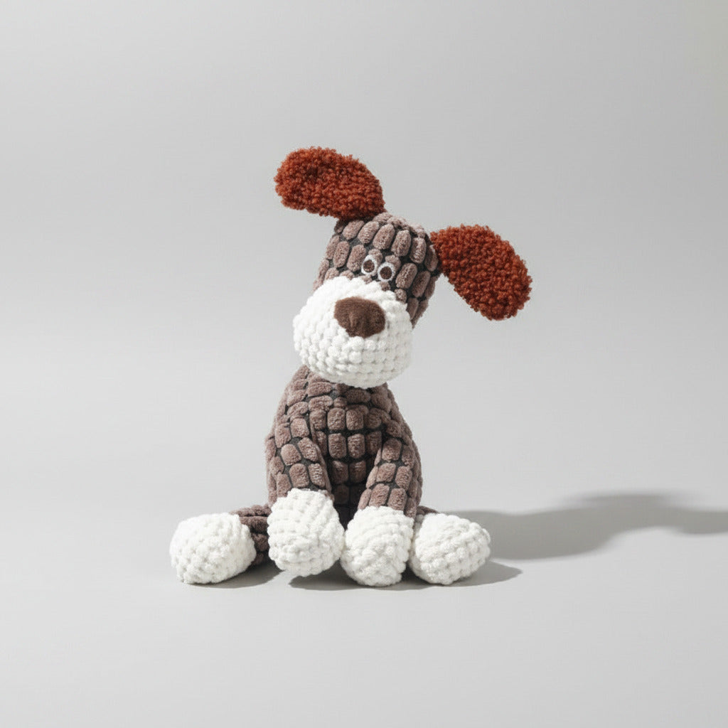 Plush squeaky dog toy in dark gray with brown ears and white muzzle detail.