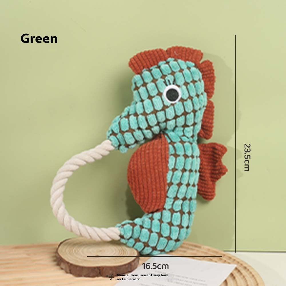 Green seahorse plush dog toy with rope handle and textured scale pattern