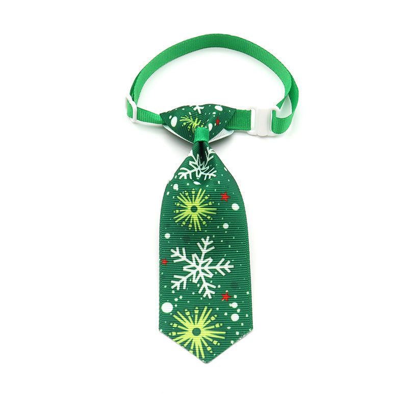Dark green Christmas pet tie with snowflake and burst patterns, clip-on strap