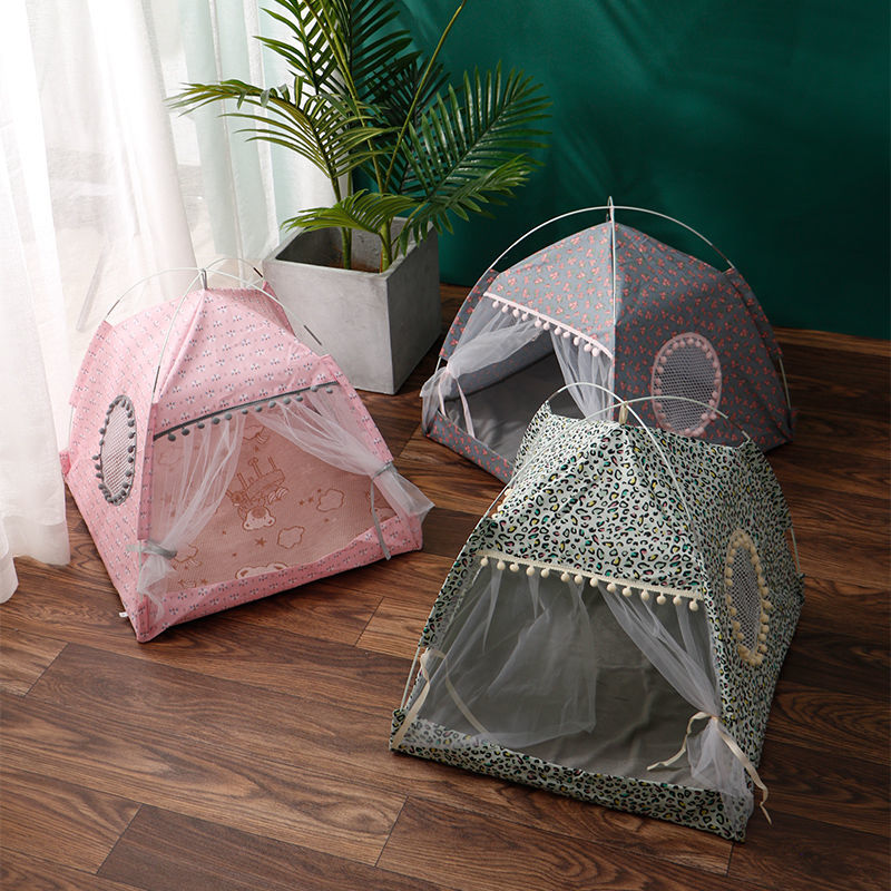 Pet tent beds in pink and leopard patterns with open mesh doorways and pom trim