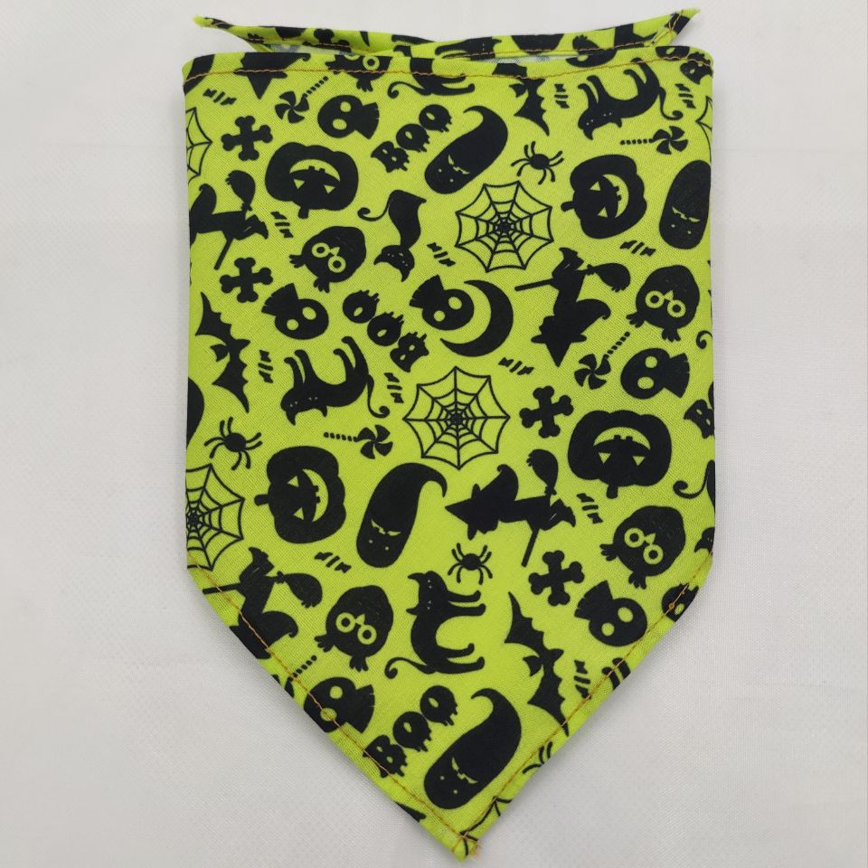 Pet triangle bandana in neon yellow-green with black spiders, spiderwebs, bats, and pumpkins