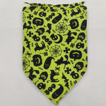 Pet triangle bandana in neon yellow-green with black spiders, spiderwebs, bats, and pumpkins