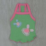 Green cotton suspender pet vest with pink trim and embroidered flower appliques
