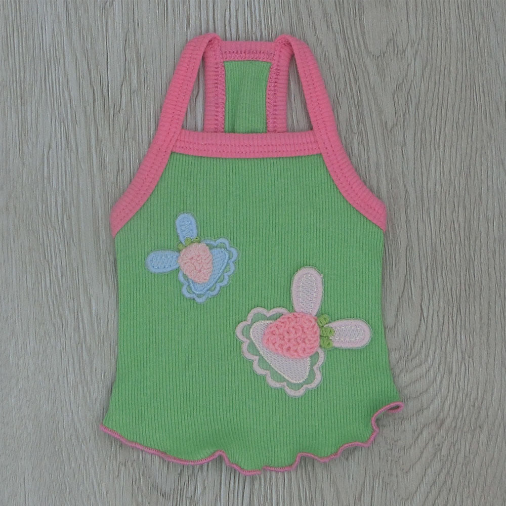 Green cotton suspender pet vest with pink trim and embroidered flower appliques