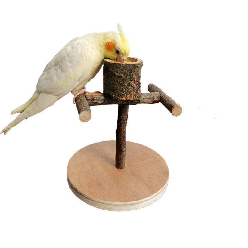 Wood parrot training stand with log perch, round base platform, and hanging feed cup.