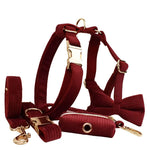 Dark red corduroy dog harness with bow tie and poop bag holder
