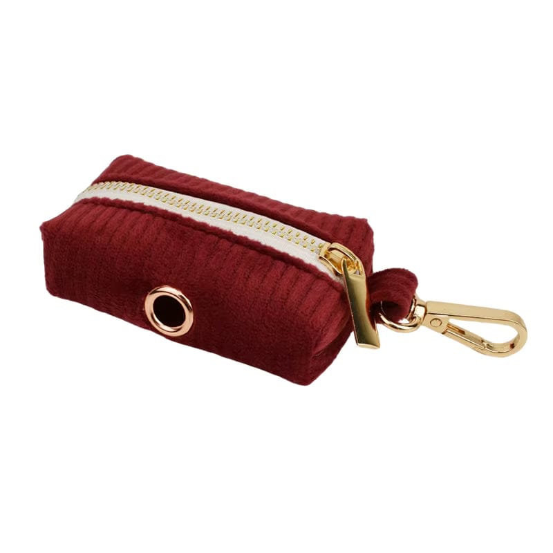 Dark red corduroy poop bag holder with gold-tone clasp and grommet