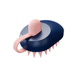 Silicone pet hair remover comb with dark blue body and pink bristle head, compact grooming brush