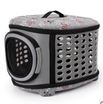Foldable pet carrier handbag in gray with perforated side panels and mesh window