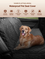 Black quilted pet seat cover laid on a car rear seat with attached side straps