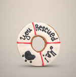 Rescue-themed cookie toy donut with black paw and dog drawings, red details