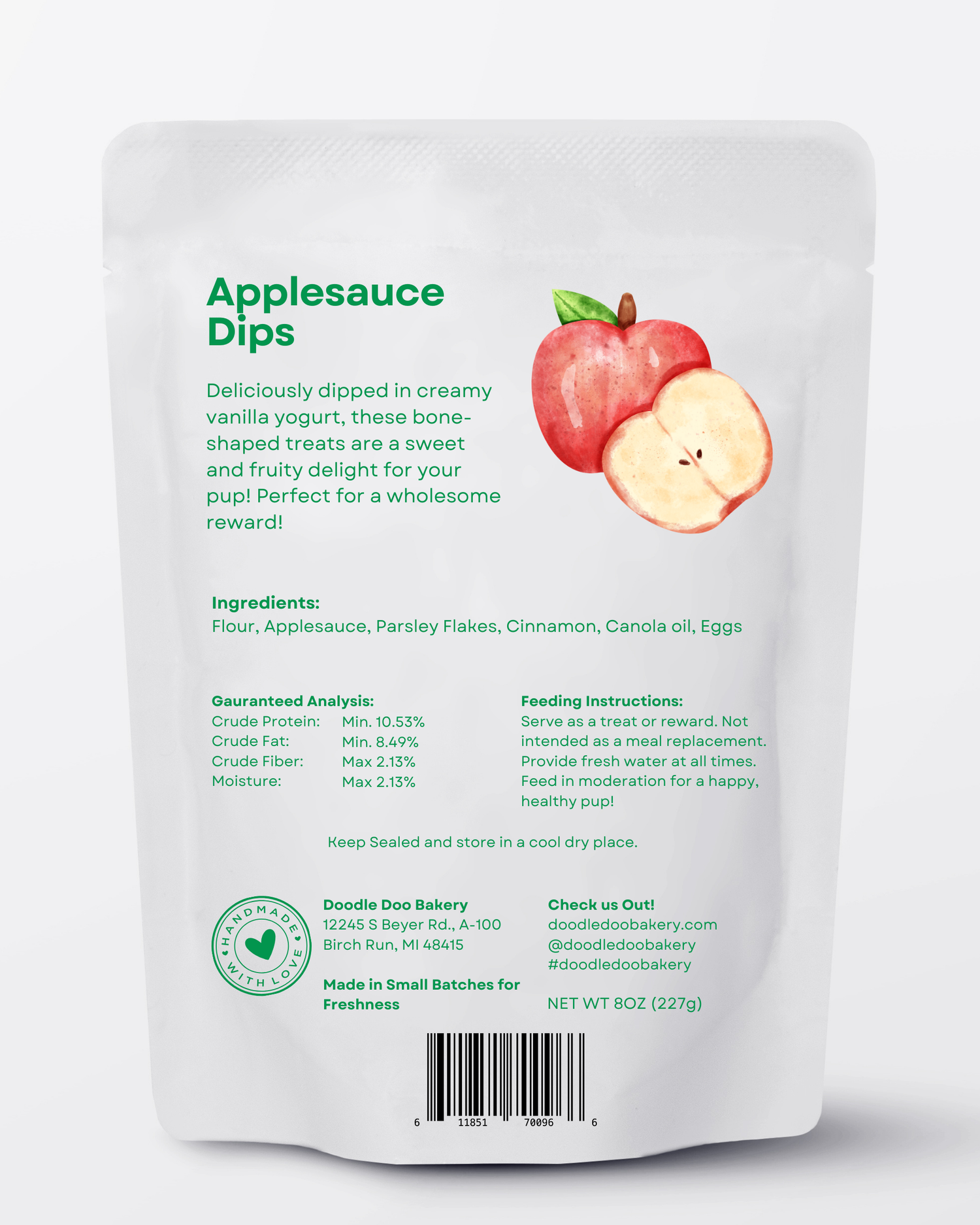 Dog treat pouch back view with ingredients list and apple graphic, net 8 oz (227 g).