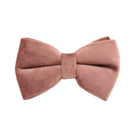 Dusty pink velvet bow accessory with center knot.