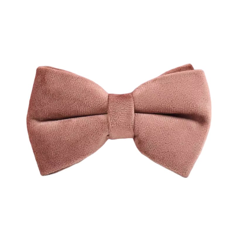 Dusty pink velvet bow accessory with center knot.