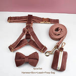 Dusty pink velvet pet harness set with bow, leash, and zippered poop bag pouch.