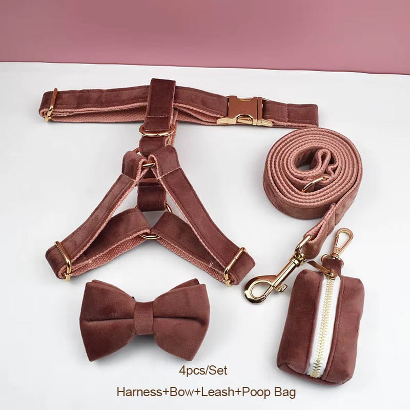 Dusty pink velvet pet harness set with bow, leash, and zippered poop bag pouch.