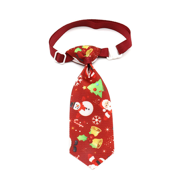 Red Christmas pet tie with Santa and reindeer patterns, clip-on strap