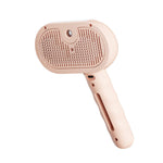 Pet steam brush with blush-pink handle and textured stainless-steel cleaning plate
