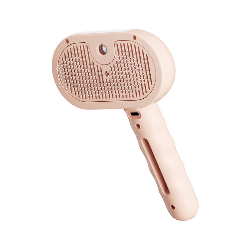 Pet steam brush with blush-pink handle and textured stainless-steel cleaning plate