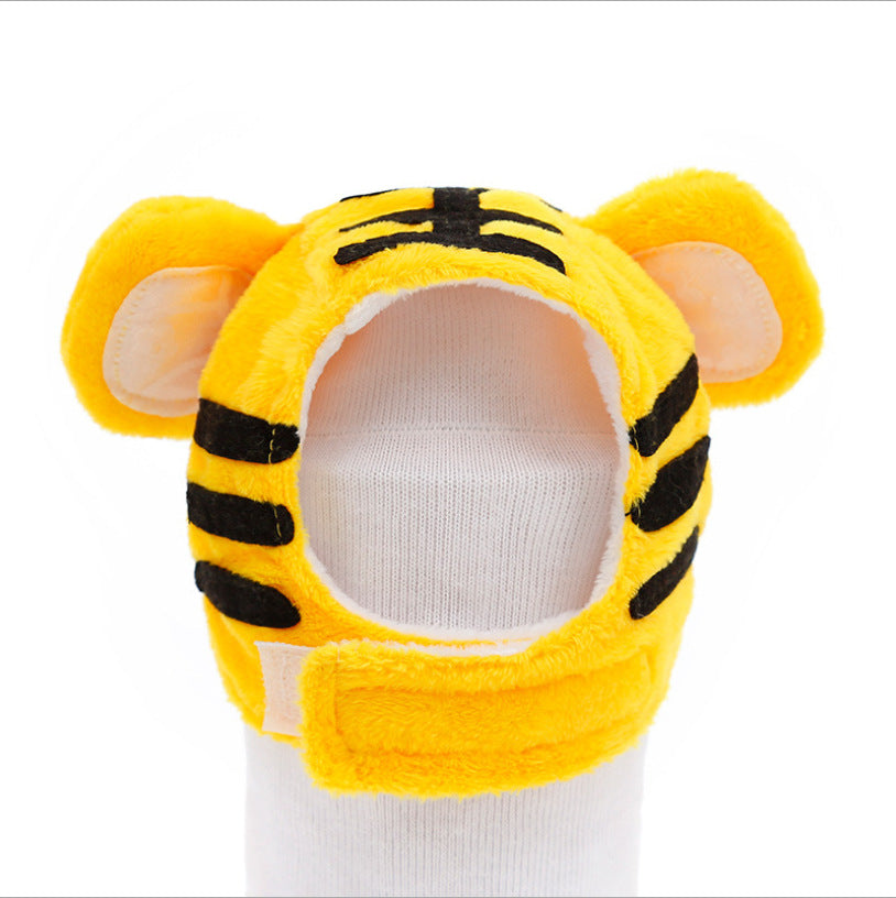 Tiger plush pet hat with yellow hood, striped muzzle, and ears