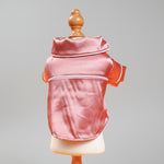 Pink satin pet pajama jacket back view with white edge piping and hood trim