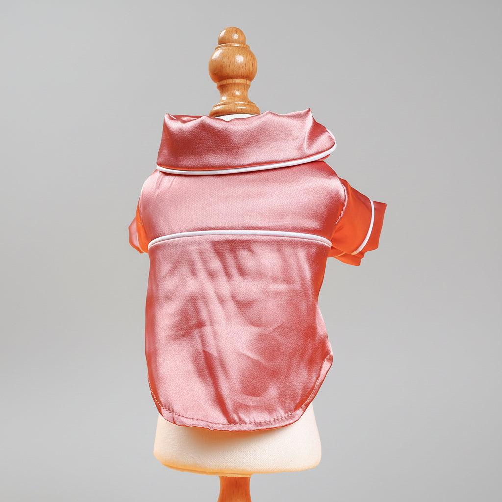 Pink satin pet pajama jacket back view with white edge piping and hood trim