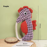 Purple seahorse plush dog toy with rope handle and textured scale pattern