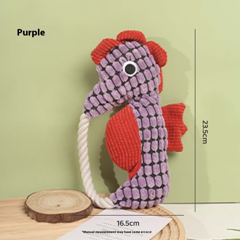 Purple seahorse plush dog toy with rope handle and textured scale pattern