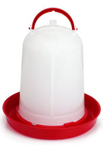 Plastic poultry waterer with red base and white reservoir, snap-together lid handle
