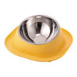 Yellow tilted cat food bowl with stainless steel inner dish
