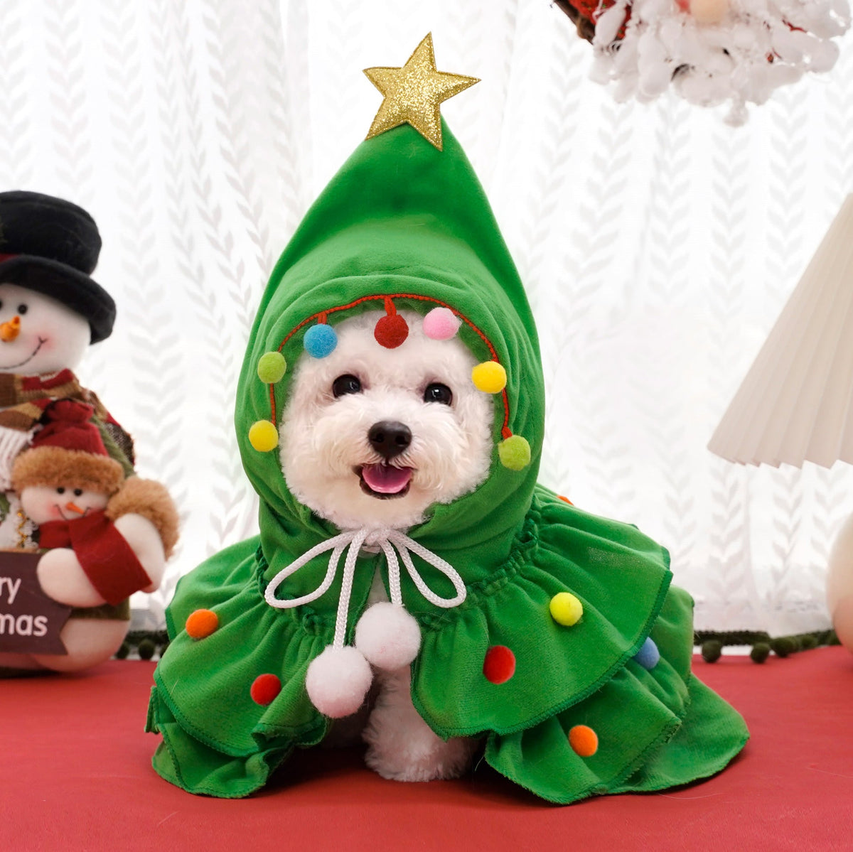 Green Christmas tree hooded costume with gold star, multicolor pom-poms, and white dangling ties