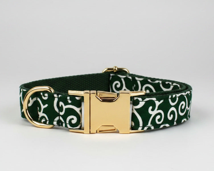 Green swirl dog collar close-up with gold buckle and D-ring hardware