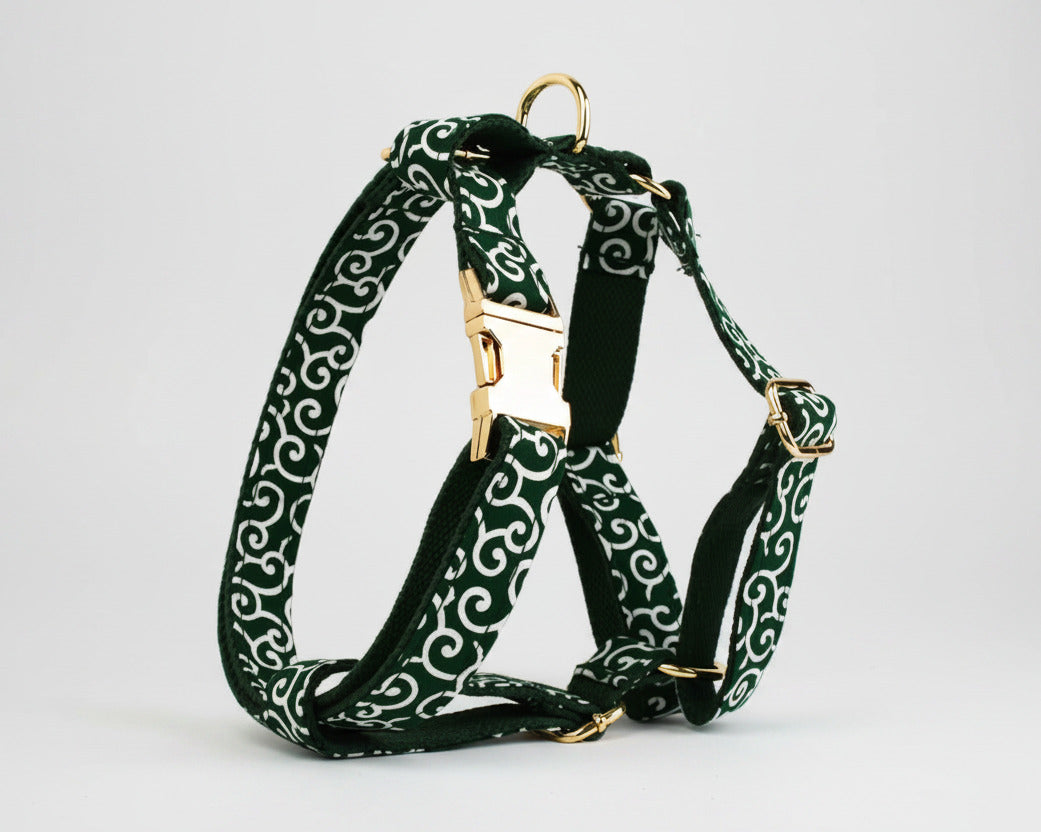 Green swirl dog harness with gold hardware and adjustable front strap ring
