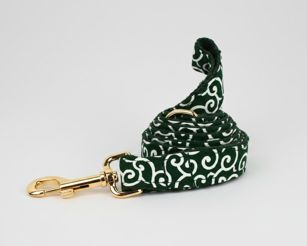 Green swirl dog leash with gold trigger clip and matching patterned fabric