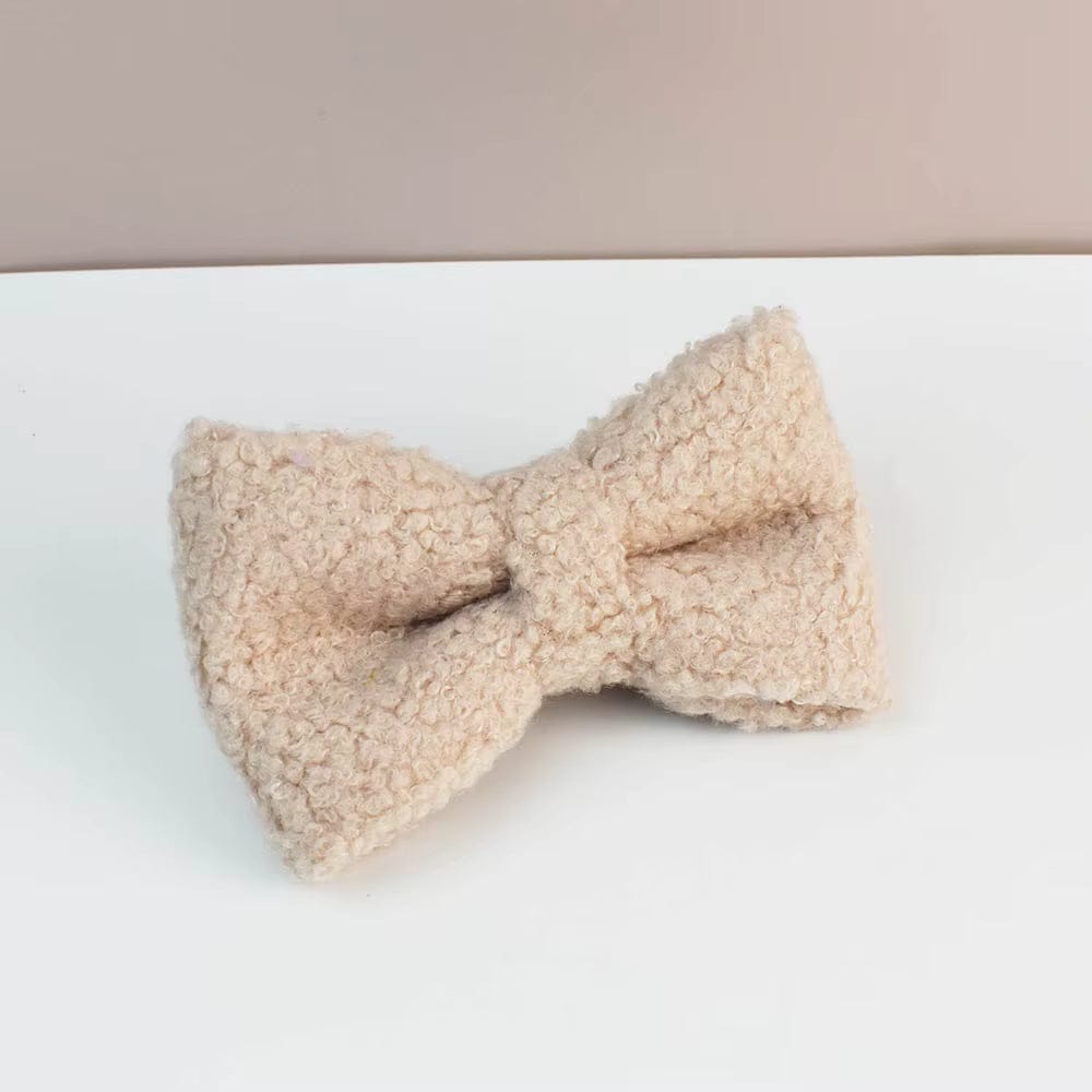 Beige teddy bow tie accessory with textured fabric center knot