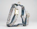Dusty blue floral dog harness with gold clips and adjustable straps