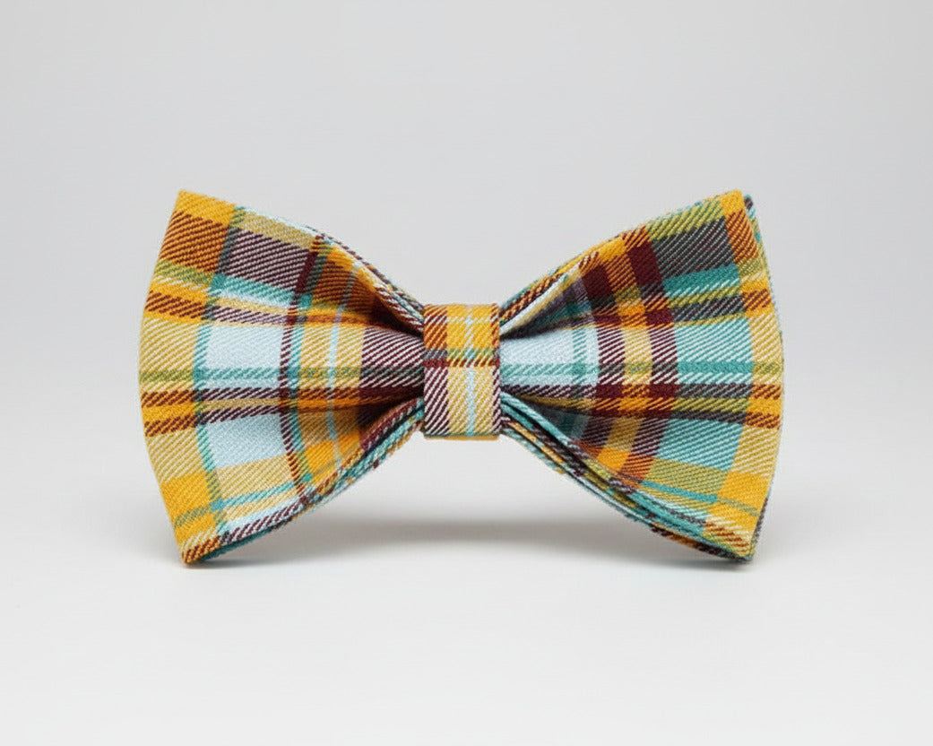Plaid bow tie with teal, orange, and mustard check pattern
