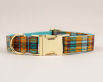 Plaid dog collar with gold-tone hardware and adjustable strap loop