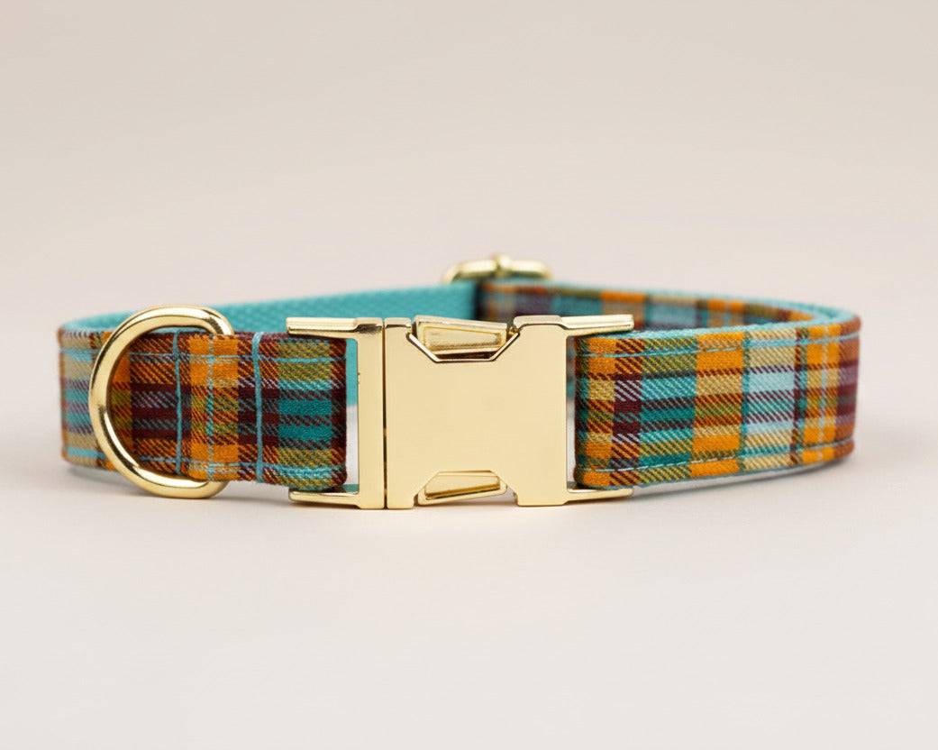 Plaid dog collar with gold-tone hardware and adjustable strap loop