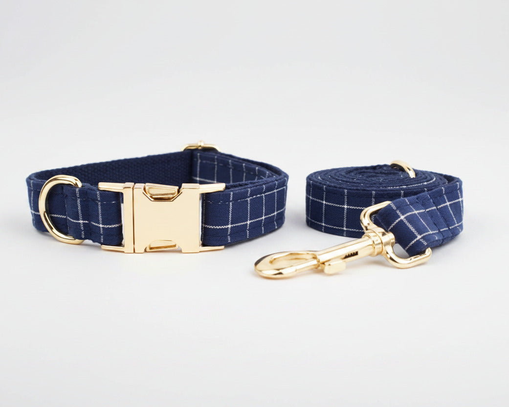 Dark blue plaid collar and matching leash with gold hardware