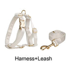 White satin pet harness with matching white satin leash and gold buckles