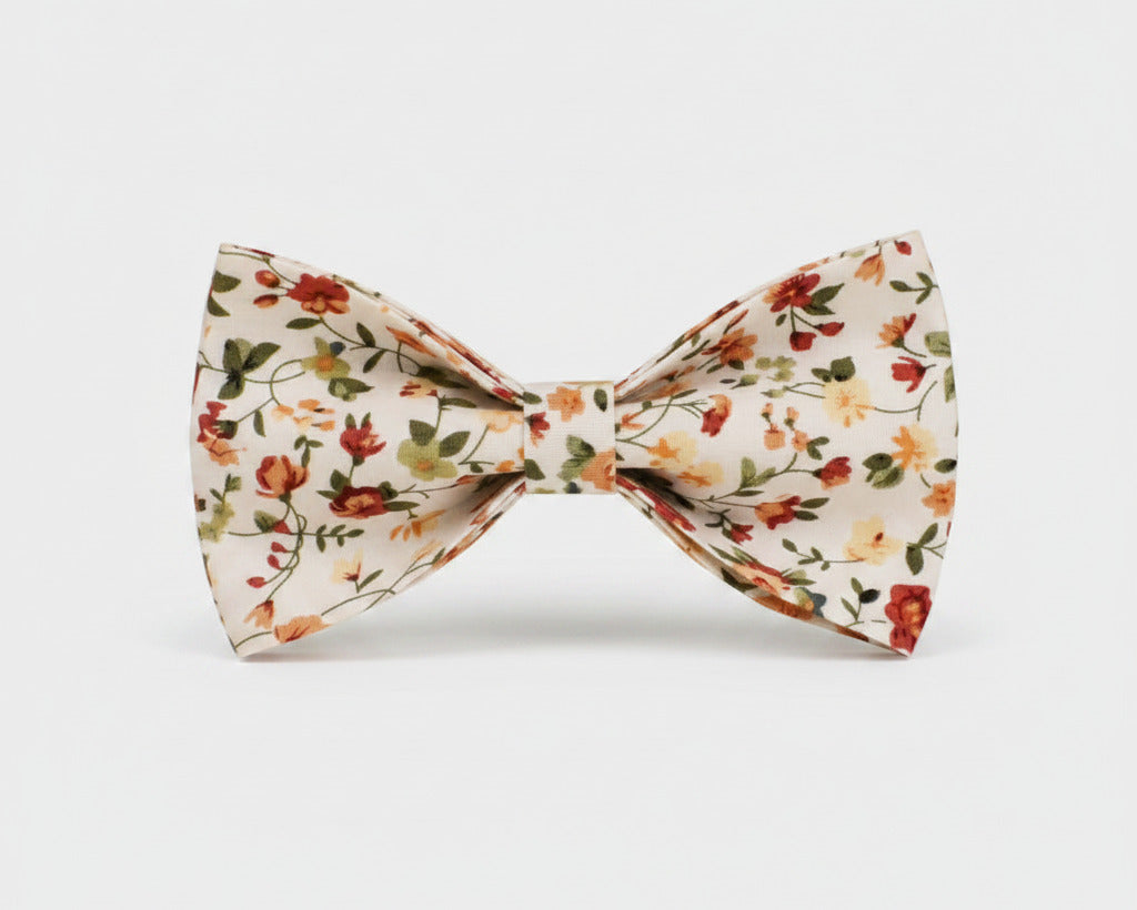 Floral dog bowtie with ivory base and small blossom print, center clip attachment