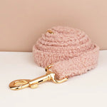 Pink teddy plush dog leash with gold clip and ring, laid flat