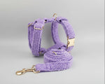 Purple teddy plush harness and leash with gold hardware, laid out