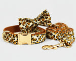 Velvet leopard collar with metal buckle, bow tie, leash, and rolled poop bag