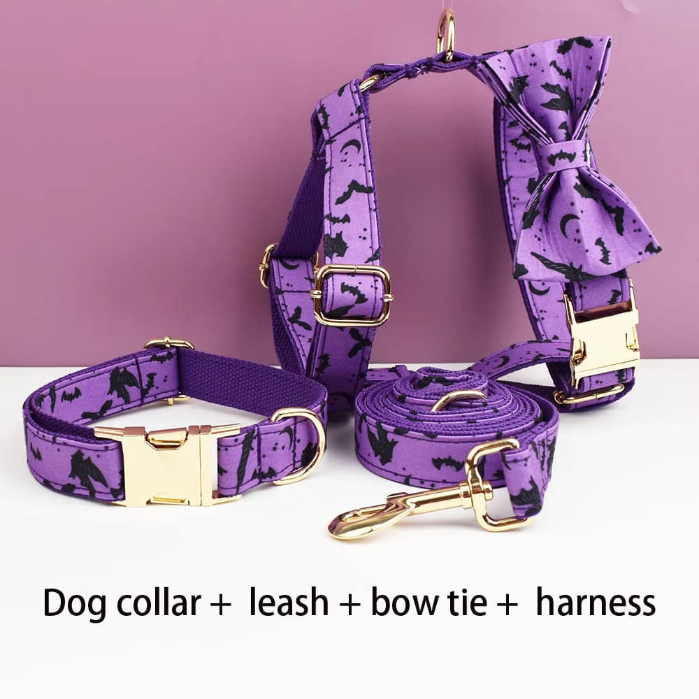 Purple dog collar, leash, bow tie, and harness set with gold hardware and bat print